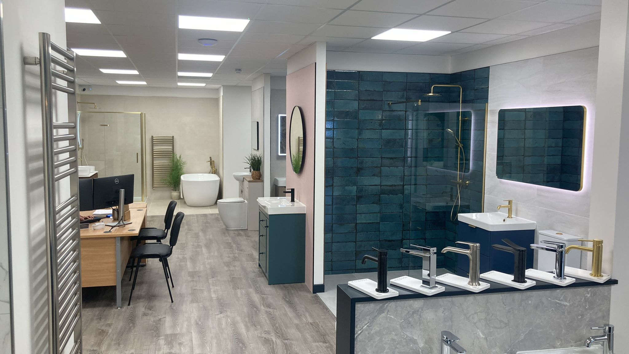 Bathroom suites, tiles and brassware on display in the Pochin Hailsham bathroom showroom